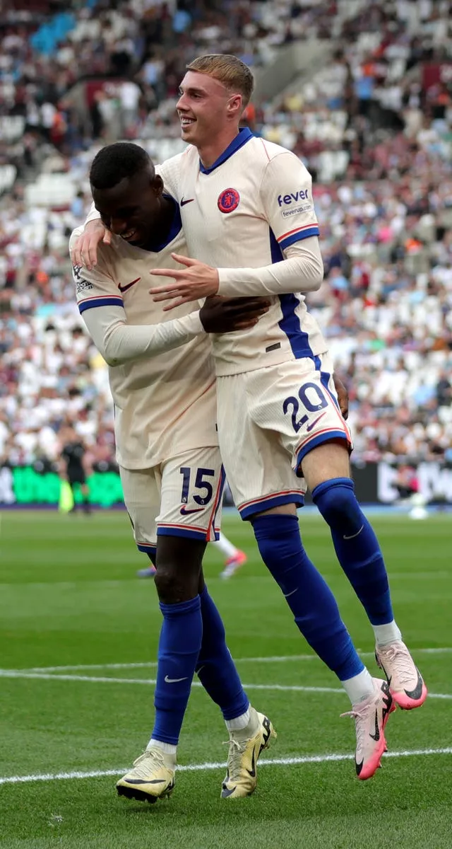 Nicholas Jakcson lifts a smiling Cole Palmer off the floor as they celebrate the third Chelsea goal. 