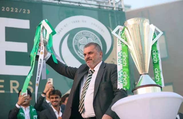 Former Celtic manager Ange Postecoglou with their trophy during celebrations at Celtic Park