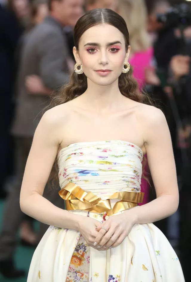 Lily Collins in an off-the-shoulder dress at a film premiere