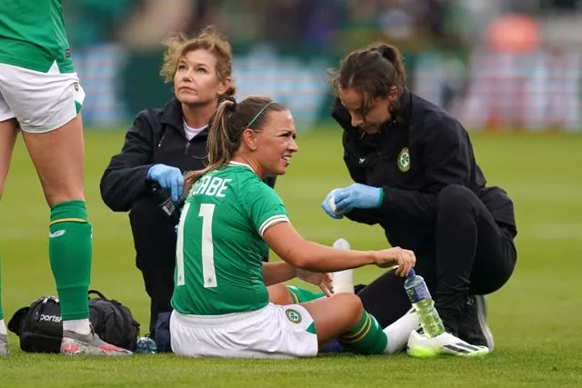 McCabe receives medical attention prior to being substituted in the game against France (Brian Lawless/PA)