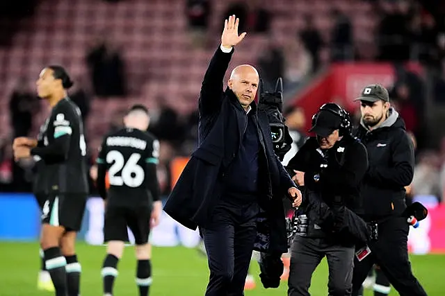 Arne Slot applauds the fans at the end of the match