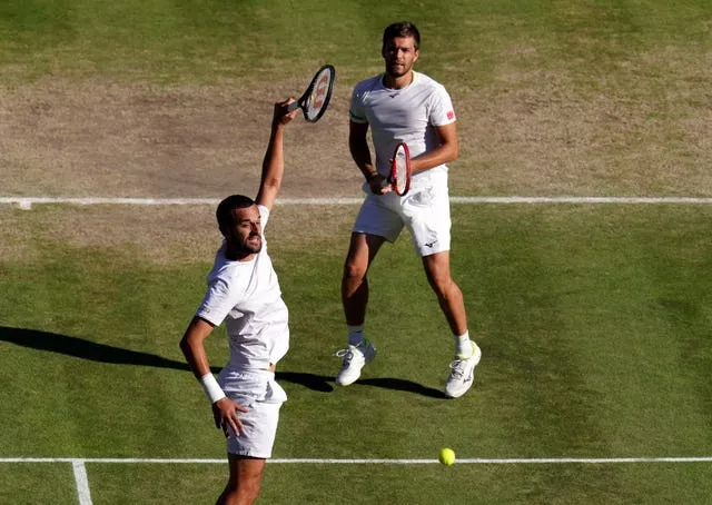 Mate Pavic (left) played in the final with a broken right wrist