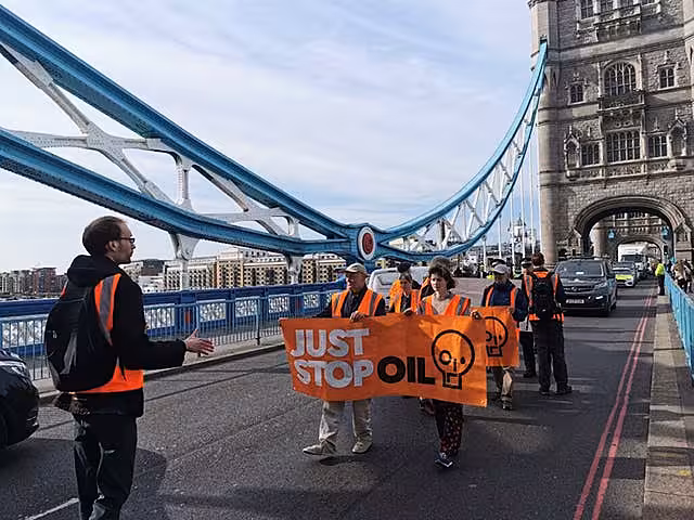 Activists stage a slow walk protest in central London