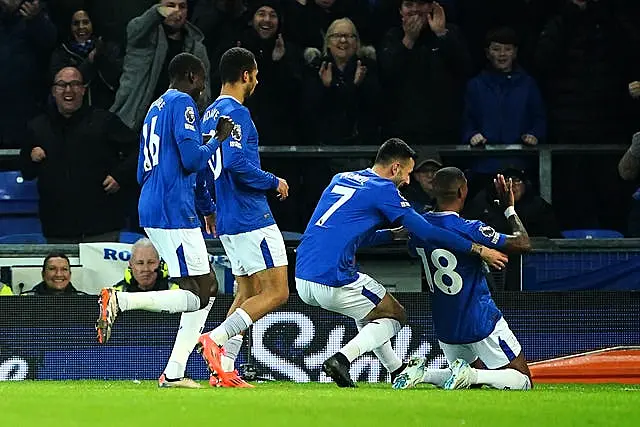 Everton’s Ashley Young slides on his knees to celebrate scoring against Wolves at Goodison Park