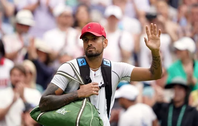 Nick Kyrgios waves to the Centre Court crowd after his victory