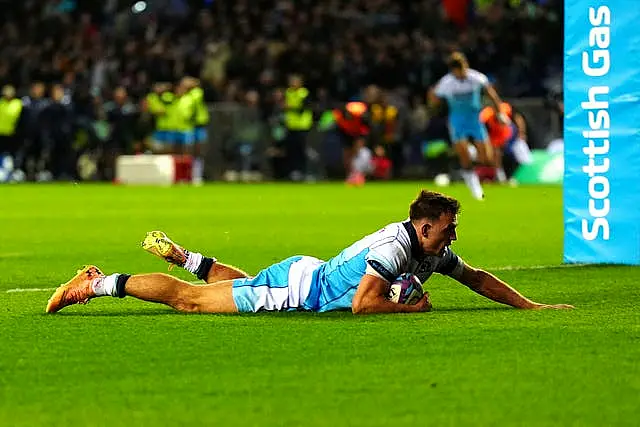 Ben White dives over the line