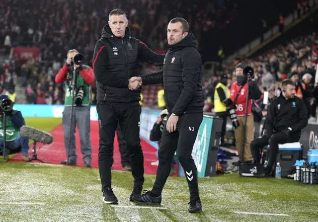 Nathan JOnes (right|) shakes hands with Lincoln's Mark Kennedy (left).