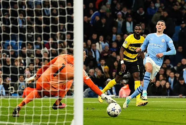 Phil Foden, right, scores Manchester City’s second goal