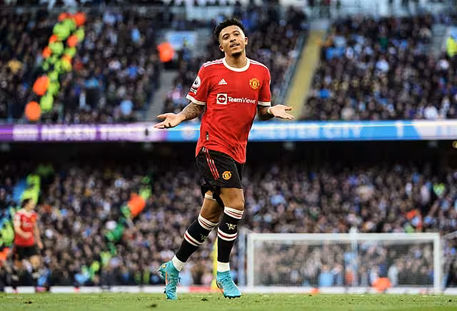Jadon Sancho celebrates scoring in the Manchester derby 