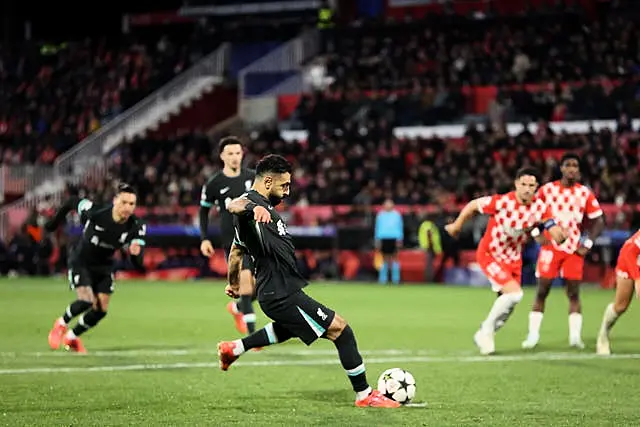 Mohamed Salah hits a penalty with his left foot