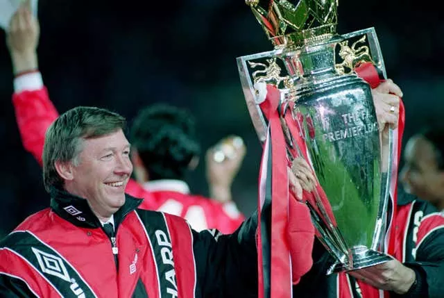 Sir Alex Ferguson lifts the 1992-93 Premier League trophy