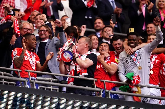 Steve Cooper, with trophy, ended Nottingham Forest's 23-year wait for top-flight football by securing promotion at Wembley