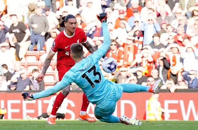 Liverpool’s Darwin Nunez (left) has a shot saved by Tottenham goalkeeper Guglielmo Vicario