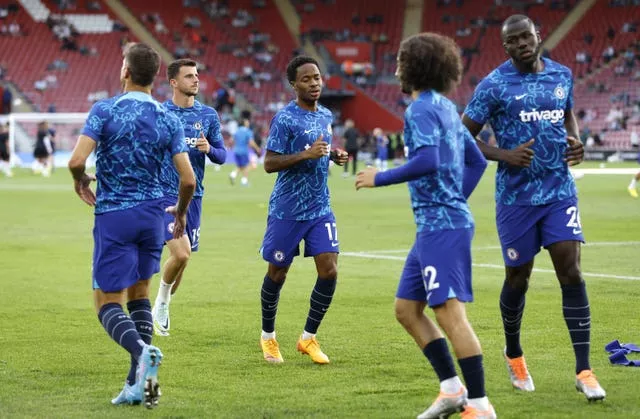 Raheem Sterling, centre, Marc Cucurella, second right, and Kalidou Koulibaly, right, warm up for Chelsea