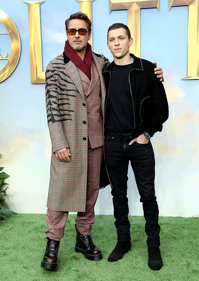 Robert Downey Jr (left) stands next to Tom Holland