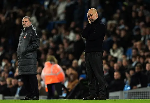 Pep Guardiola, right, appears frustrated during Manchester City's defeat to Tottenham