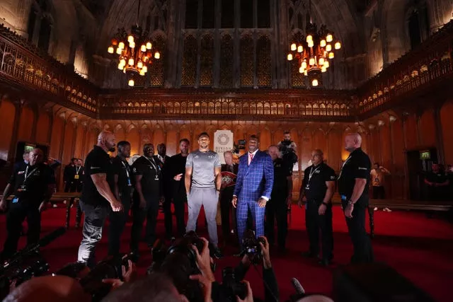 Anthony Joshua, left, and Daniel Dubois face off beneath chandeliers following a press conference at the Guildhall in London