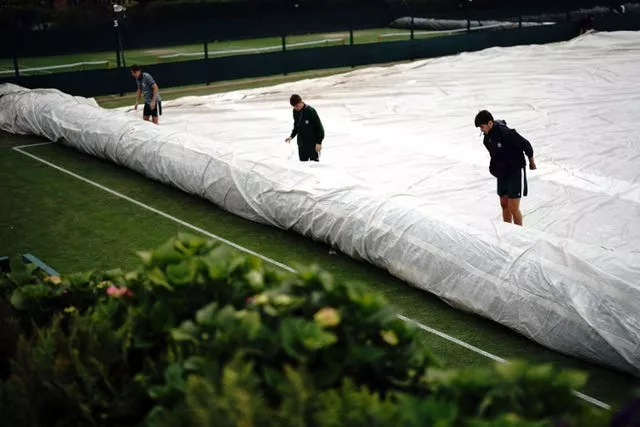 Ground staff covering practice court