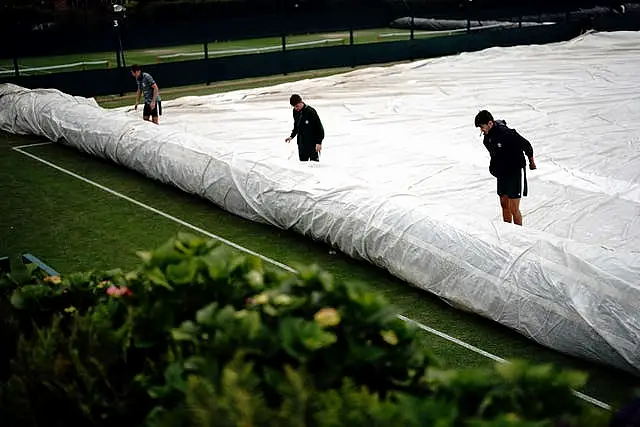 Ground staff covering practice court