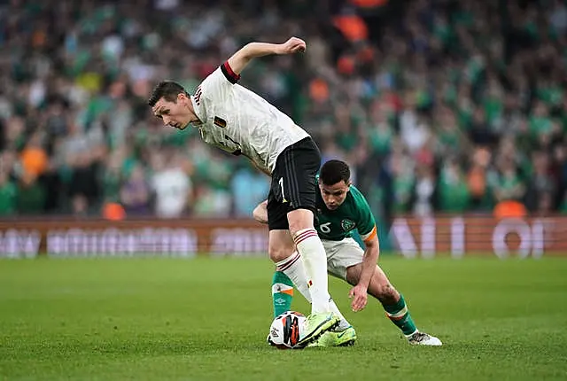 Belgium’s Hans Vanaken, left, and Josh Cullen battle for the ball