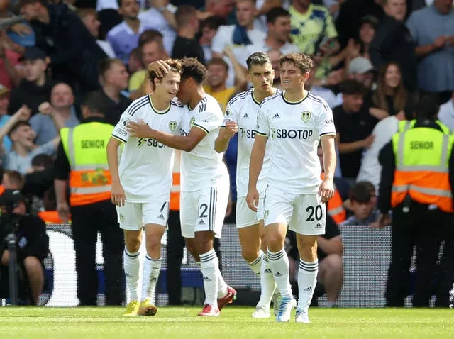 Brenden Aaronson (left) celebrates scoring Leeds' first