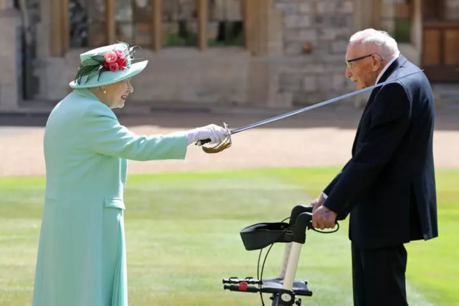 Captain Sir Tom Moore receiving his knighthood from the Queen (Chris Jackson/PA)