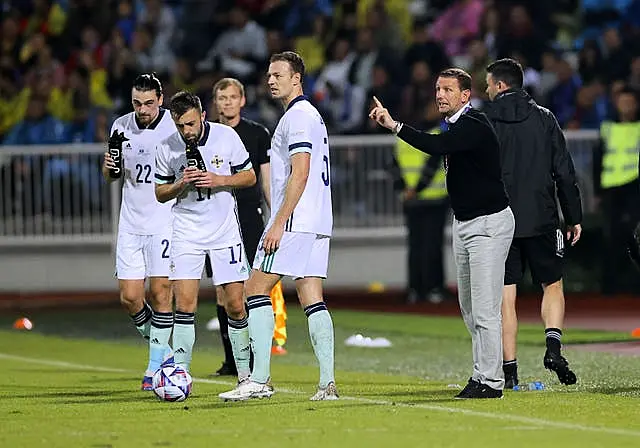 Ian Baraclough, right, instructs his players during June's defeat to Kosovo