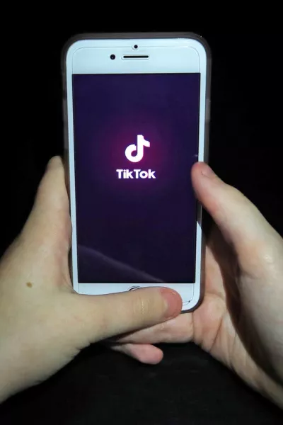 The TikTok app on a smartphone (Peter Byrne/PA)