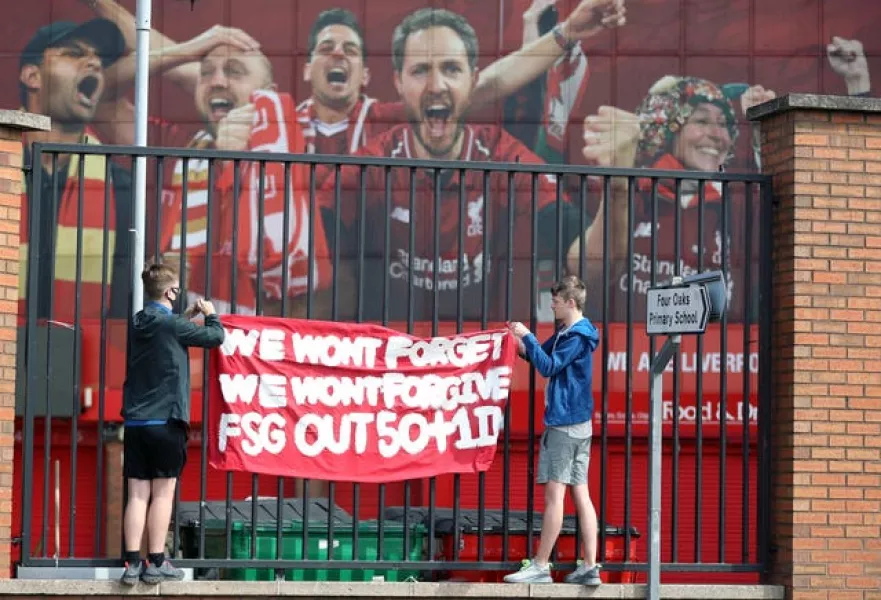Liverpool fans protest against the clubs owners outside Anfield ahead of the game against Newcastle