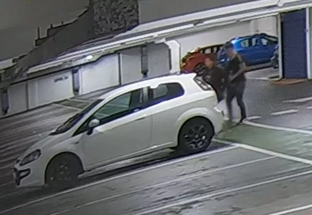 CCTV screengrab showing Alice Wood and Ryan Watson walking to his car