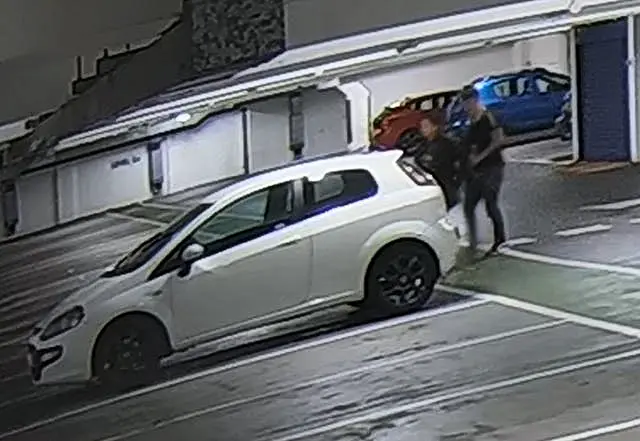 CCTV screengrab showing Alice Wood and Ryan Watson walking to his car