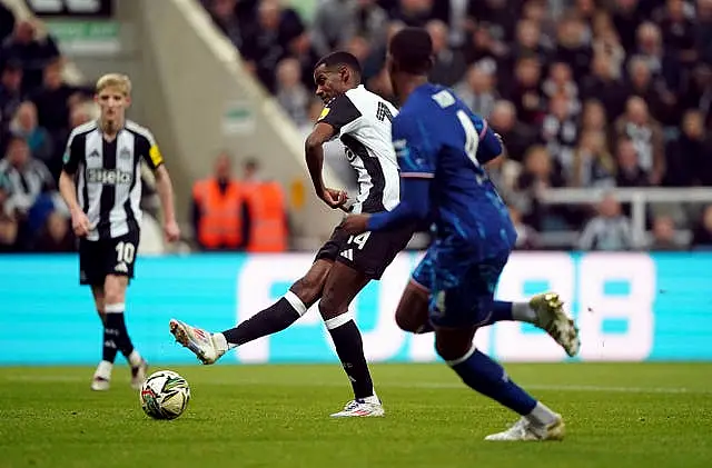 Newcastle striker Alexander Isak shoots with his right foot