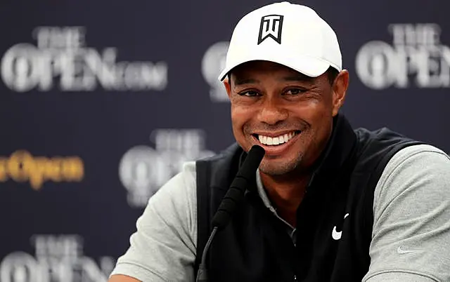 Tiger Woods smiles during a press conference