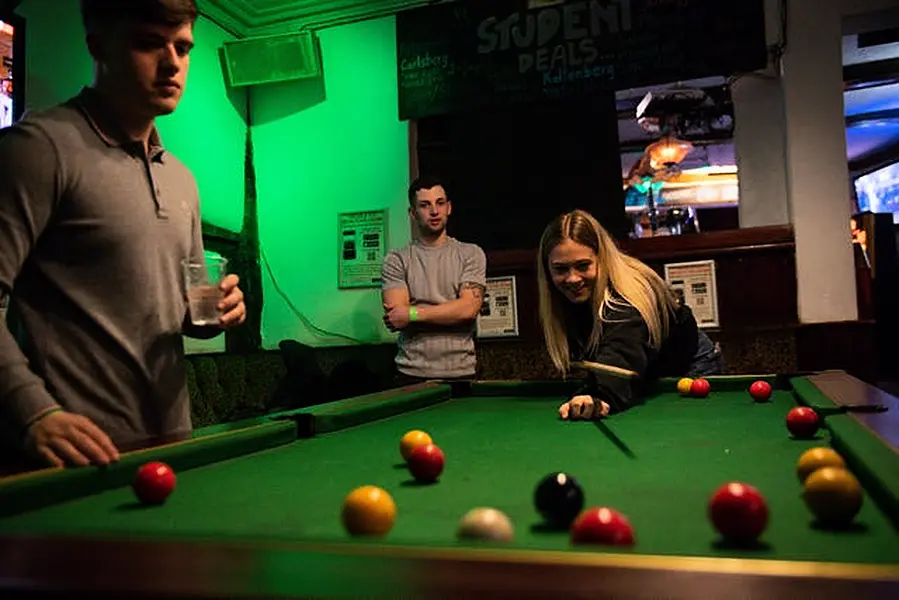 The pool table had also been dormant during the months when drinking had been an outdoors activity (Jacob King/PA)