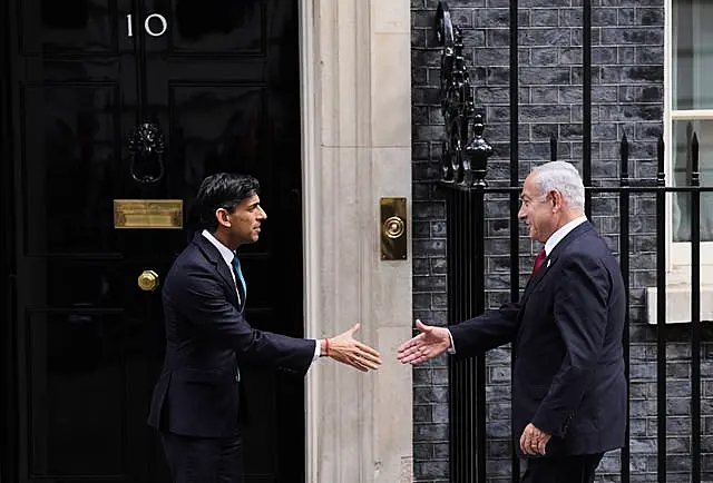 Prime Minister Rishi Sunak, left, welcomes Mr Netanyahu to 10 Downing Street ahead of a meeting 