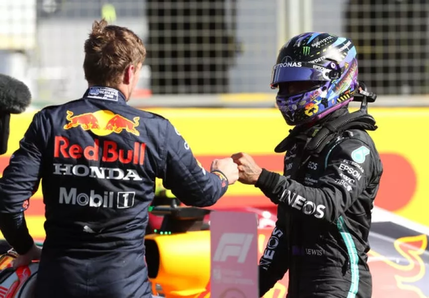 Max Verstappen (left) and Lewis Hamilton bump fists after the Sprint