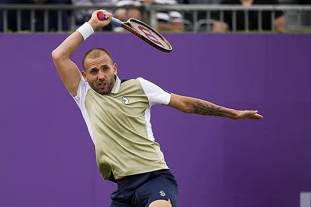 Dan Evans hits a forehand