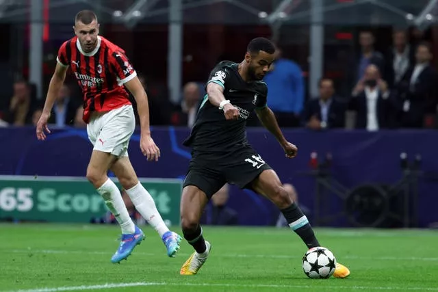 Cody Gakpo passes the ball during Liverpool's Champions League game against AC Milan