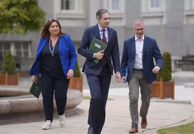 Taoiseach Simon Harris, Minister for Children Roderic O’Gorman and Minister of State Anne Rabbitte arrive for a media briefing