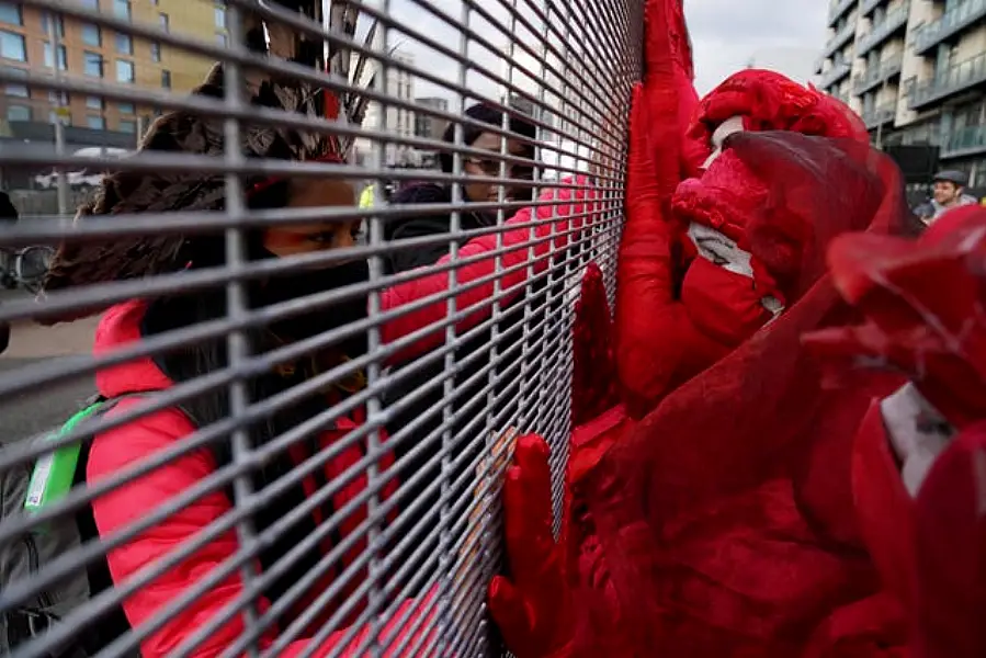 Demonstrators at a fence