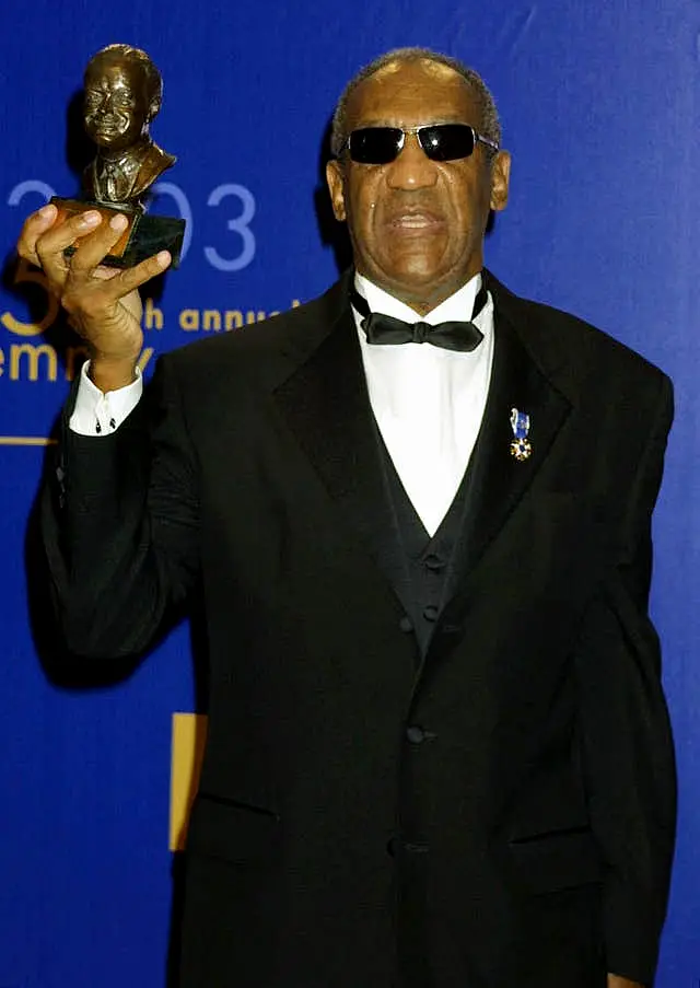 Actor Bill Cosby holding the Bob Hope Humanitarian Award during the 55th Annual Primetime Emmy Awards at the Shrine Auditorium in Los Angeles