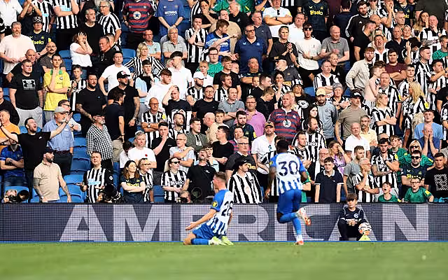 Newcastle fans look on as Brighton’s Evan Ferguson celebrates scoring his second goal