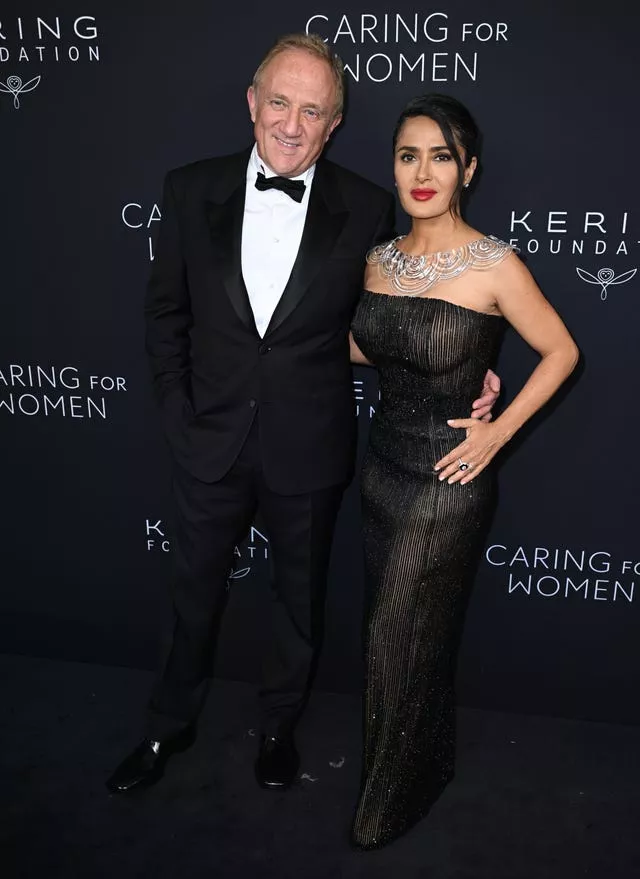 Hayek and Pinault pose on red carpet for Kering Foundation’s Caring for Women dinner