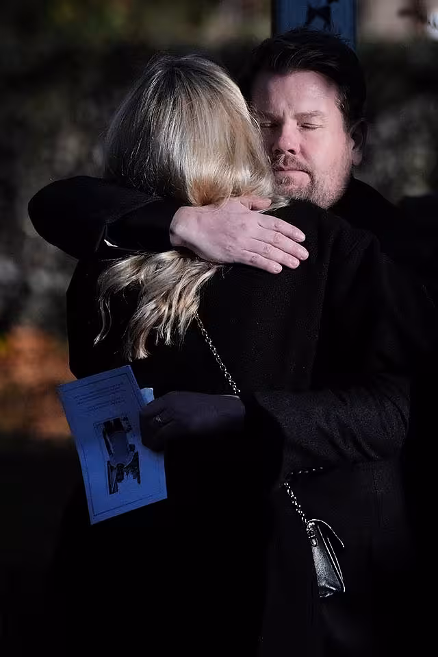 James Corden hugs another guest after the funeral service for One Direction singer Liam Payne 
