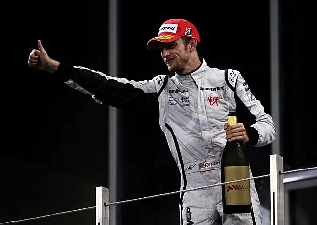 Brawn GP’s Jenson Button celebrates his third place during the Abu Dhabi Grand Prix in 2009 