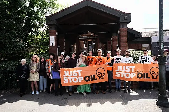 Two Just Stop Oil protesters Samuel Johnson, and Patrick Hart, centre right, with supporters at Wimbledon Magistrates’ Court