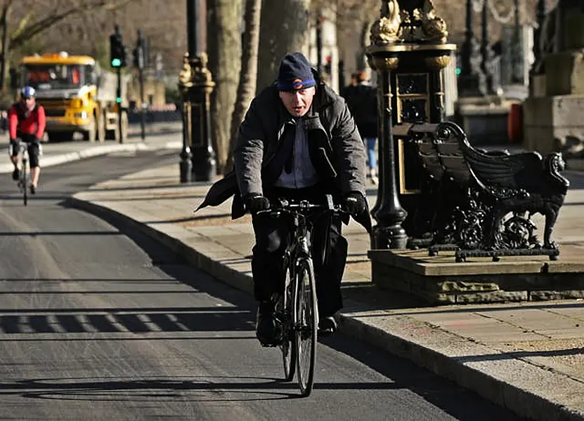 Boris johnson on online a bike