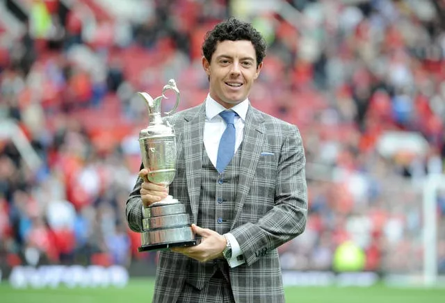 Rory McIlroy displays the Claret Jug at Manchester United's home ground Old Trafford after his 2014 Open win