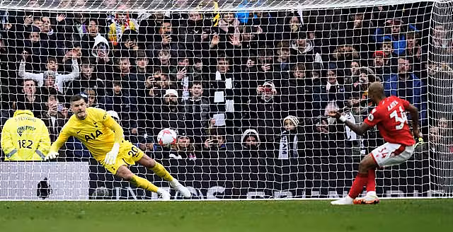Fraser Forster saves a late penalty from Andre Ayew