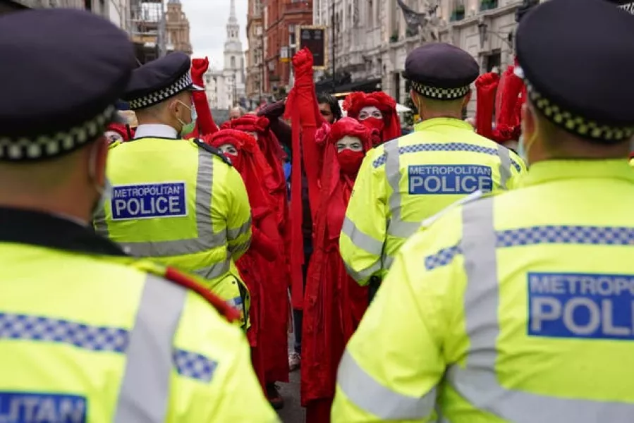 Red Rebels gather during a protest by members of Extinction Rebellion